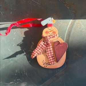 Festive Snowman Ornament with Red and Brown Accents